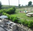 A place for barbecues and a place to sit and watch the children play