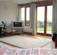 Light and spacious lounge with doors opening out in to the garden
