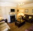 Real fireplace in sitting room and wood burning stove in ground-floor bedroom.