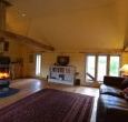 Sunny living room with wood burner