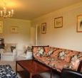 Comfortable sitting room with open fireplace 